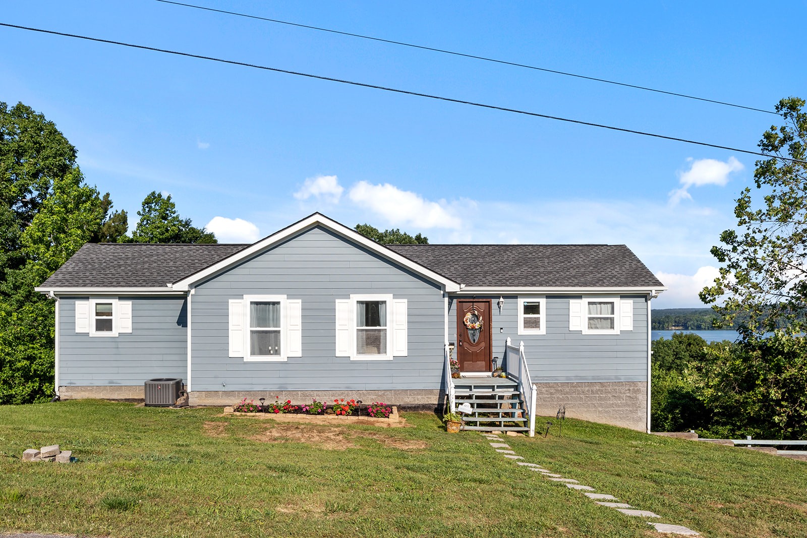 465 Turtle Point Lane Waverly, TN 37185 - Photo 17 of 49 a front view of a house with a garden
