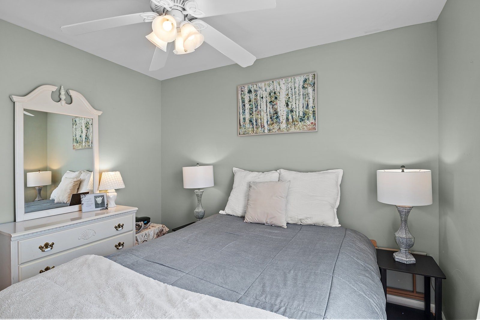 465 Turtle Point Lane Waverly, TN 37185 - Photo 31 of 49 a bedroom with a bed and a lamp on dresser