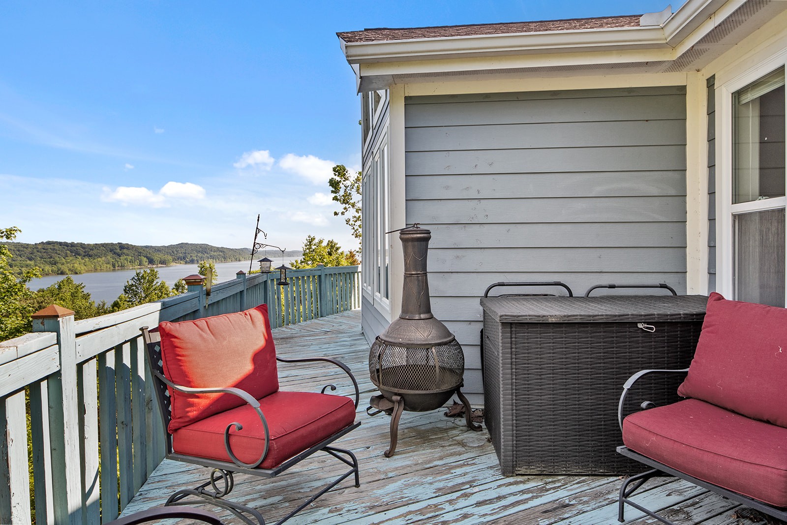 465 Turtle Point Lane Waverly, TN 37185 - Photo 38 of 49 a blue chair sitting in front of a house