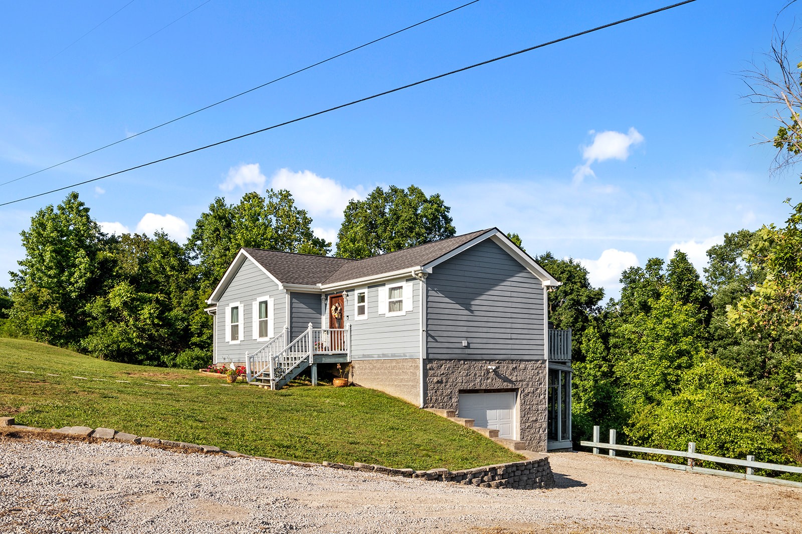 465 Turtle Point Lane Waverly, TN 37185 - Photo 44 of 49 a front view of a house with a yard and garage