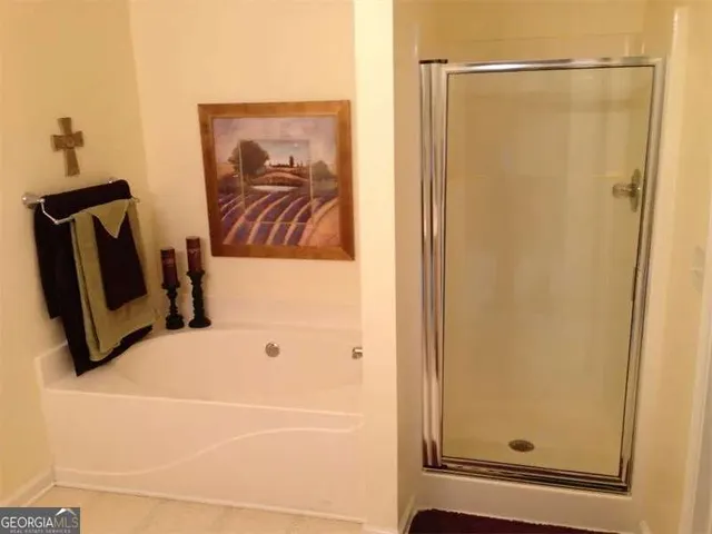 a bathroom with a vanity and a shower