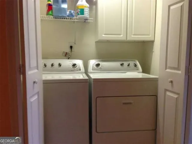 a view of a patio with table and chairs with wooden floor and plants