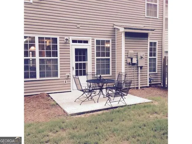 a view of backyard with green space