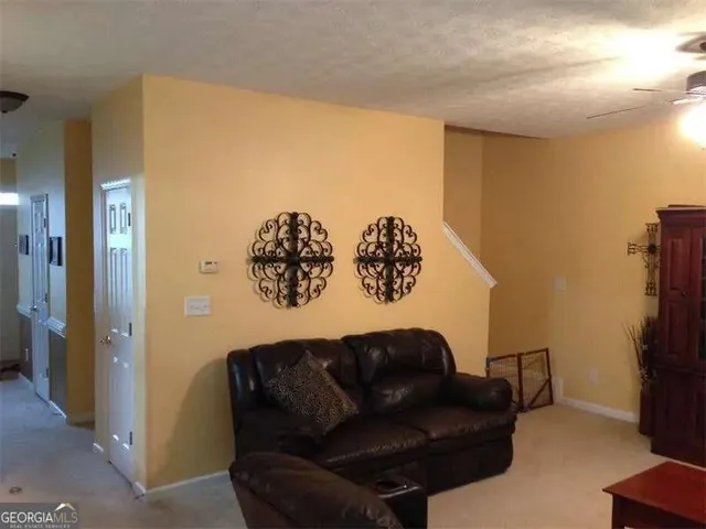 a blue couch sitting on top of a living room