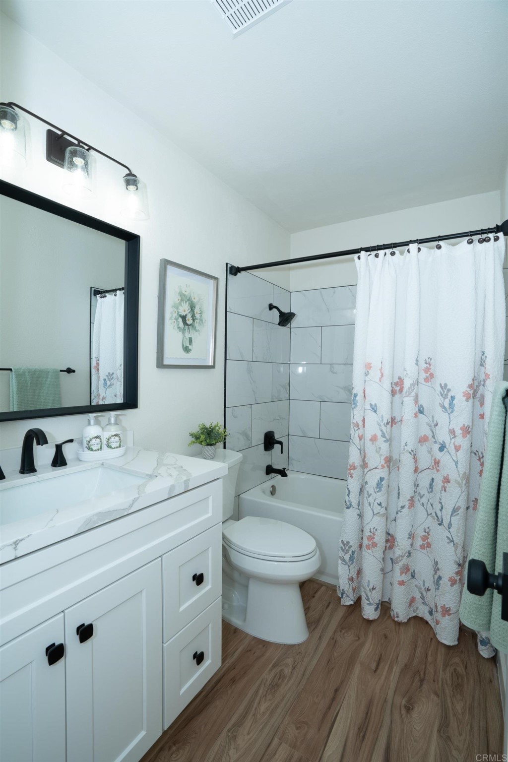 4080 Lake Boulevard Oceanside, CA 92056 - Photo 13 of 28 a bathroom with a double vanity sink toilet and shower