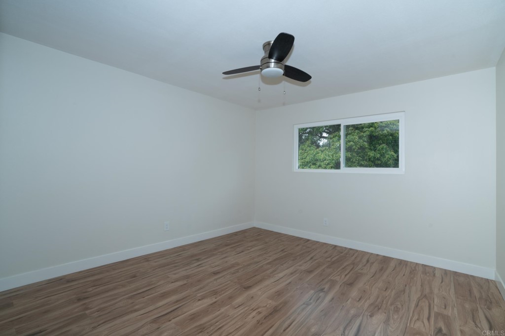 4080 Lake Boulevard Oceanside, CA 92056 - Photo 19 of 28 a view of a room with wooden floor closet and windows