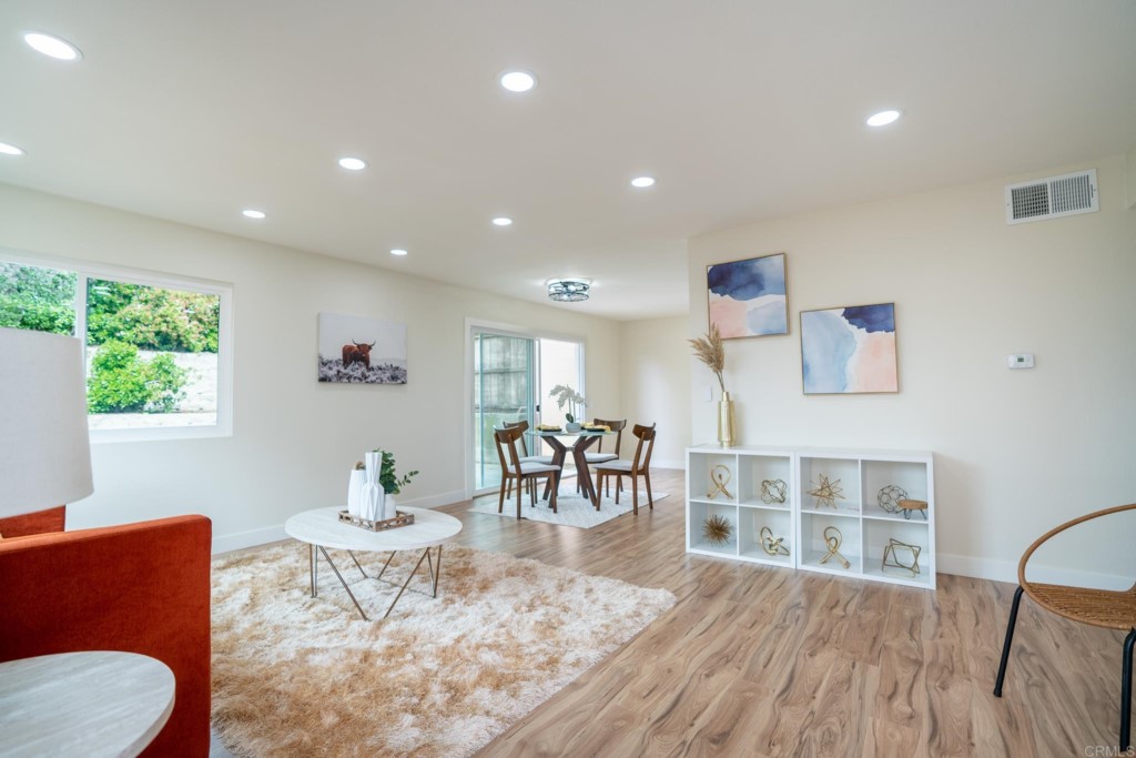 4080 Lake Boulevard Oceanside, CA 92056 - Photo 2 of 28 a living room with furniture and a wooden floor
