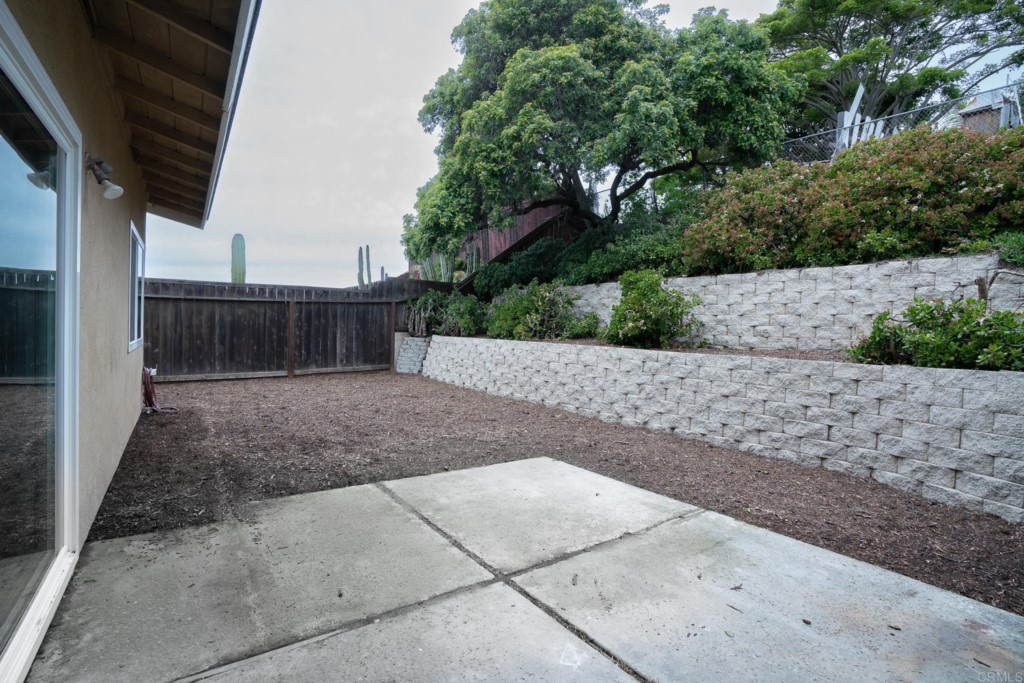 4080 Lake Boulevard Oceanside, CA 92056 - Photo 23 of 28 a view of backyard with dishwasher and wooden fence