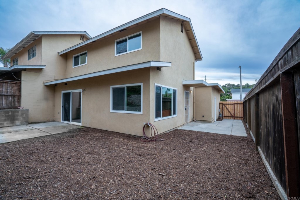 4080 Lake Boulevard Oceanside, CA 92056 - Photo 25 of 28 a view of a house with backyard and wooden fence
