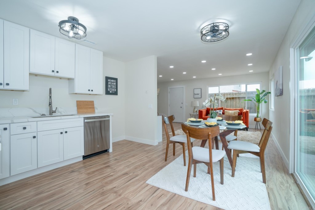4080 Lake Boulevard Oceanside, CA 92056 - Photo 5 of 28 a view of a dining room with furniture and wooden floor