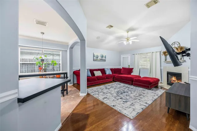 a living room with furniture rug and window