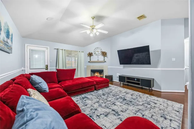a living room with furniture and a flat screen tv