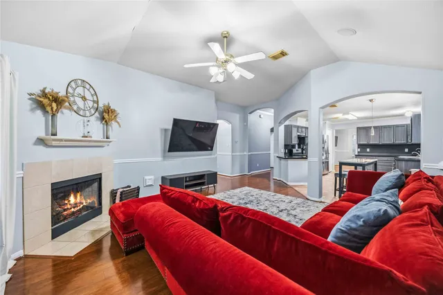 a living room with furniture and a fireplace