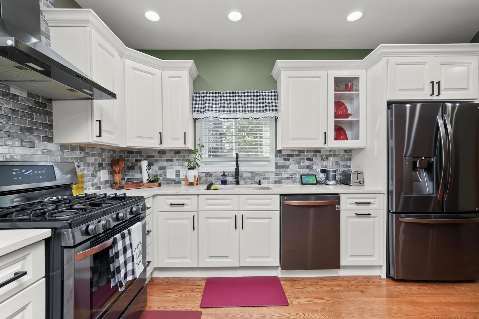 5907 West 109th Street Chicago Ridge, IL 60415 - Photo 16 of 45 a kitchen with stainless steel appliances granite countertop a stove a sink dishwasher and a refrigerator