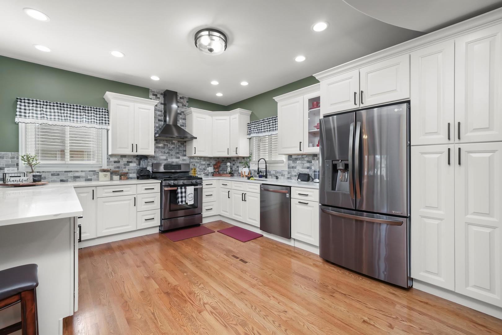5907 West 109th Street Chicago Ridge, IL 60415 - Photo 17 of 45 a kitchen with a refrigerator a sink and cabinets