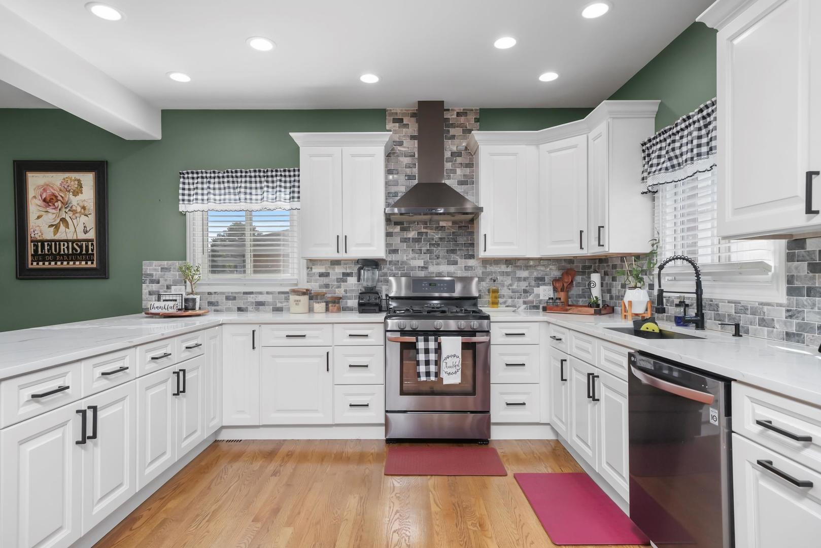 5907 West 109th Street Chicago Ridge, IL 60415 - Photo 18 of 45 a kitchen with granite countertop white cabinets stainless steel appliances a sink and a window