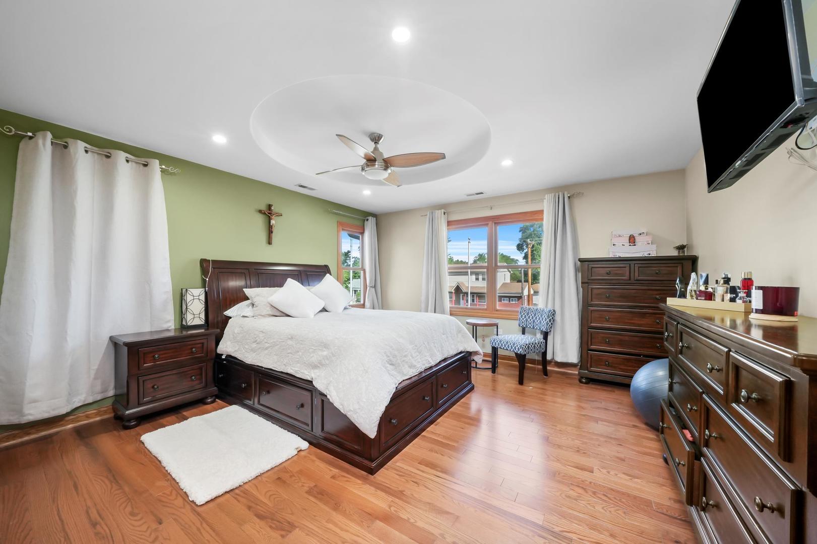 5907 West 109th Street Chicago Ridge, IL 60415 - Photo 19 of 45 a bed room with furniture and a flat screen tv