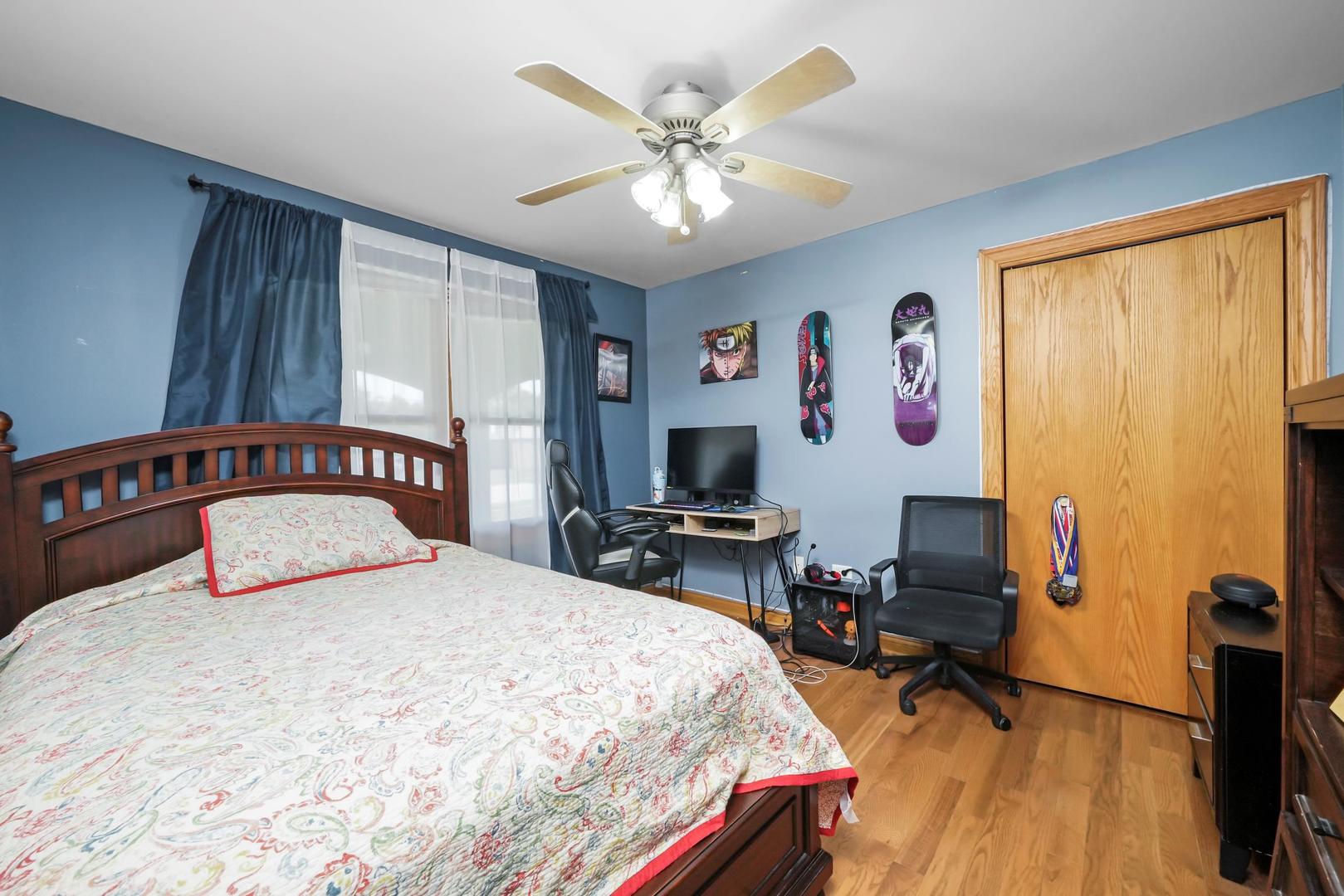 5907 West 109th Street Chicago Ridge, IL 60415 - Photo 26 of 45 a bedroom with a bed and a table in it with window