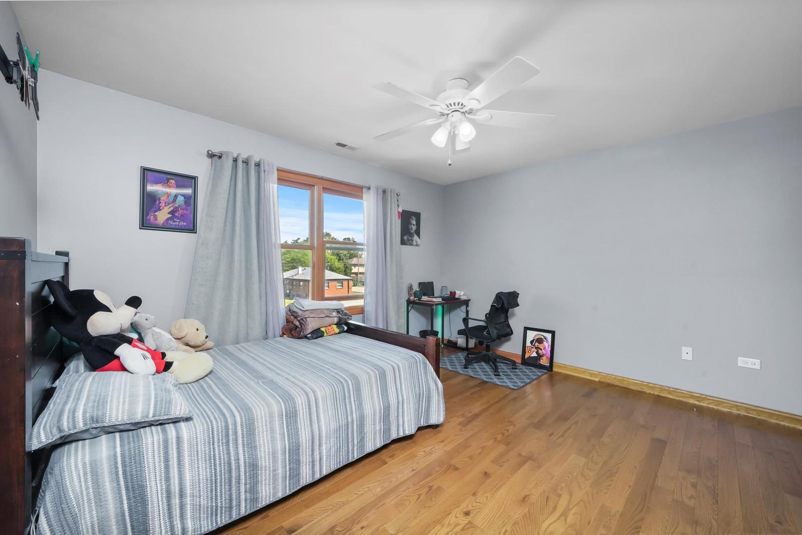 5907 West 109th Street Chicago Ridge, IL 60415 - Photo 30 of 45 a bedroom with a bed and a window