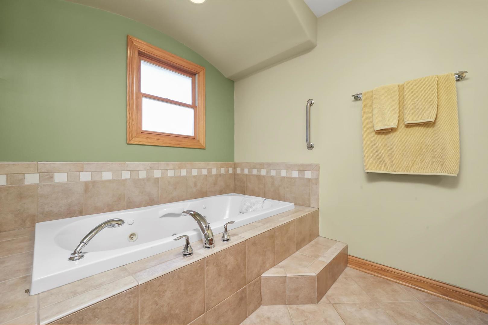5907 West 109th Street Chicago Ridge, IL 60415 - Photo 32 of 45 a bathroom with a bathtub and a sink