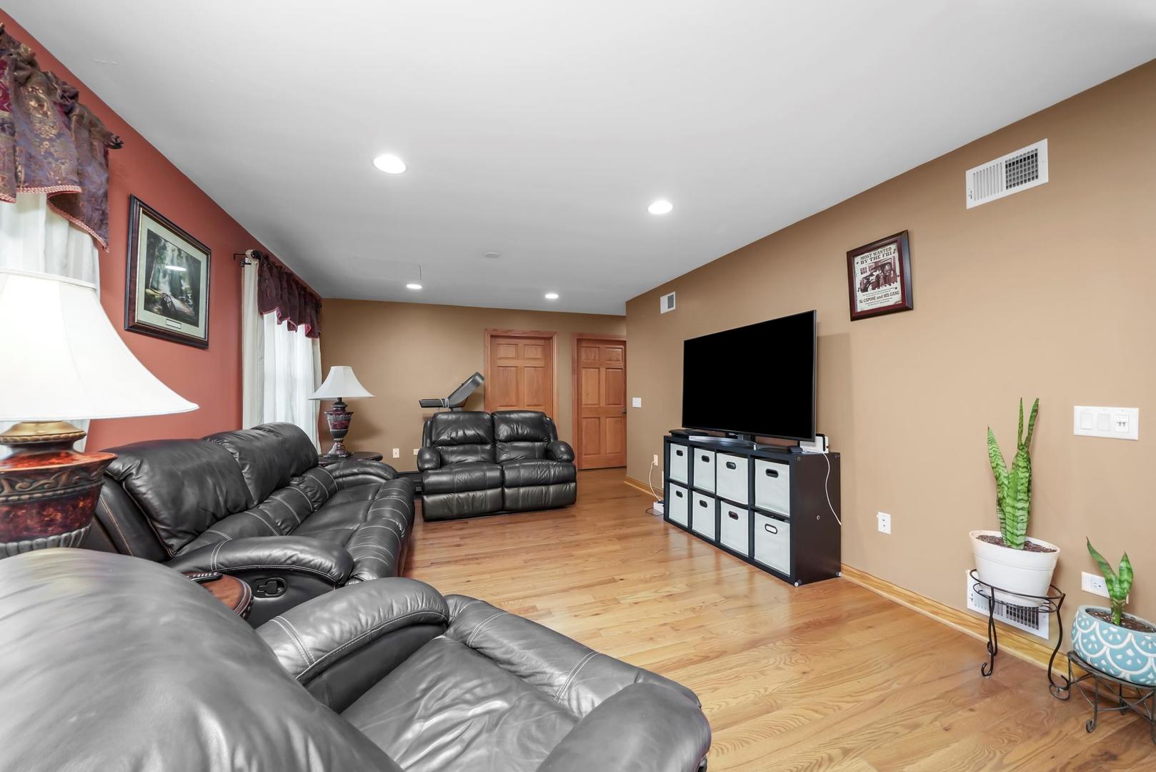 5907 West 109th Street Chicago Ridge, IL 60415 - Photo 35 of 45 a living room with furniture and a flat screen tv