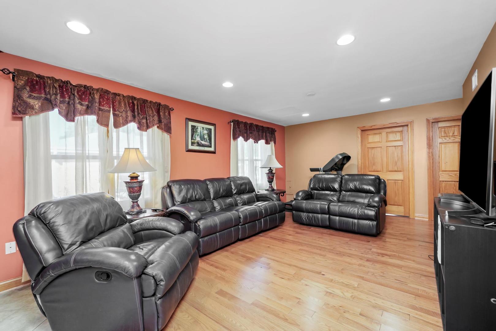 5907 West 109th Street Chicago Ridge, IL 60415 - Photo 36 of 45 a living room with furniture and a flat screen tv
