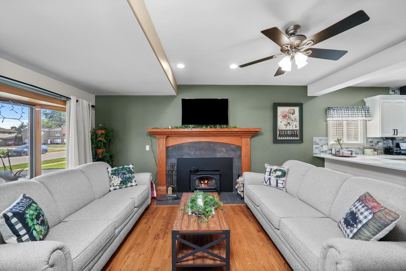 5907 West 109th Street Chicago Ridge, IL 60415 - Photo 39 of 45 a living room with furniture and a fireplace