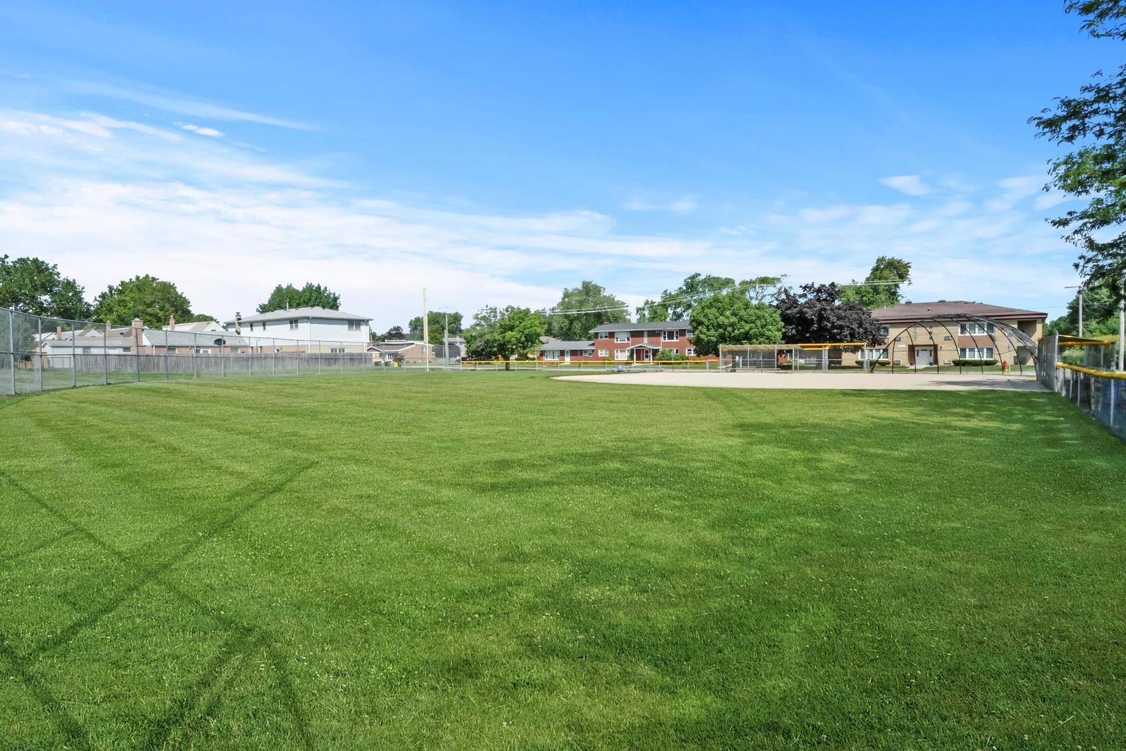 5907 West 109th Street Chicago Ridge, IL 60415 - Photo 44 of 45 a view of a big yard with a lot of trees in the background