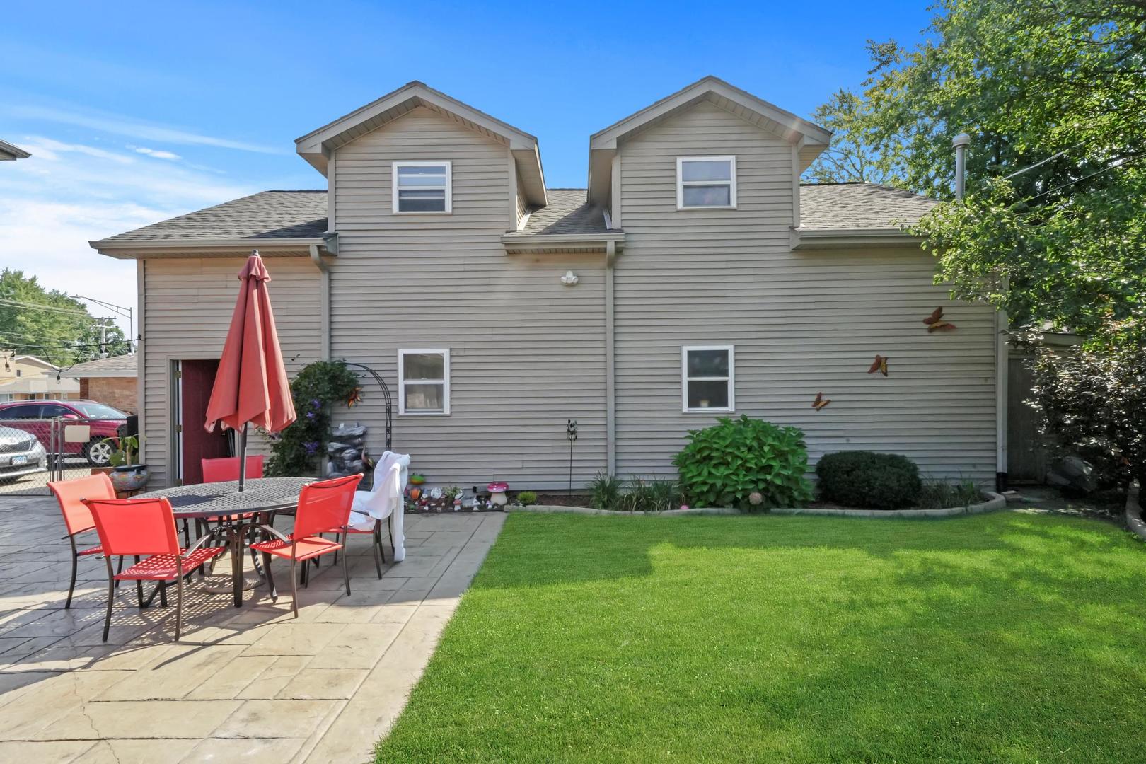 5907 West 109th Street Chicago Ridge, IL 60415 - Photo 5 of 45 a view of a house with a yard and furniture