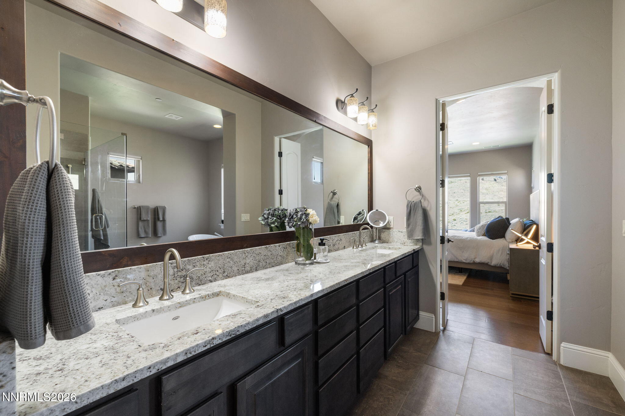 3172 Vista Favoloso Reno, NV 89519 - Photo 37 of 71 a en suite bathroom with a granite countertop sink and mirror