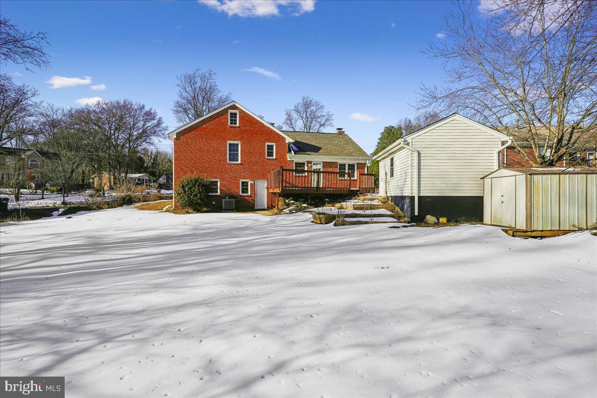 7039 Calamo Street Springfield, VA 22150 - Photo 49 of 70 a view of a house with a street