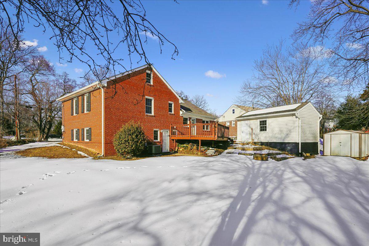 7039 Calamo Street Springfield, VA 22150 - Photo 50 of 70 a view of a house with snow on the background