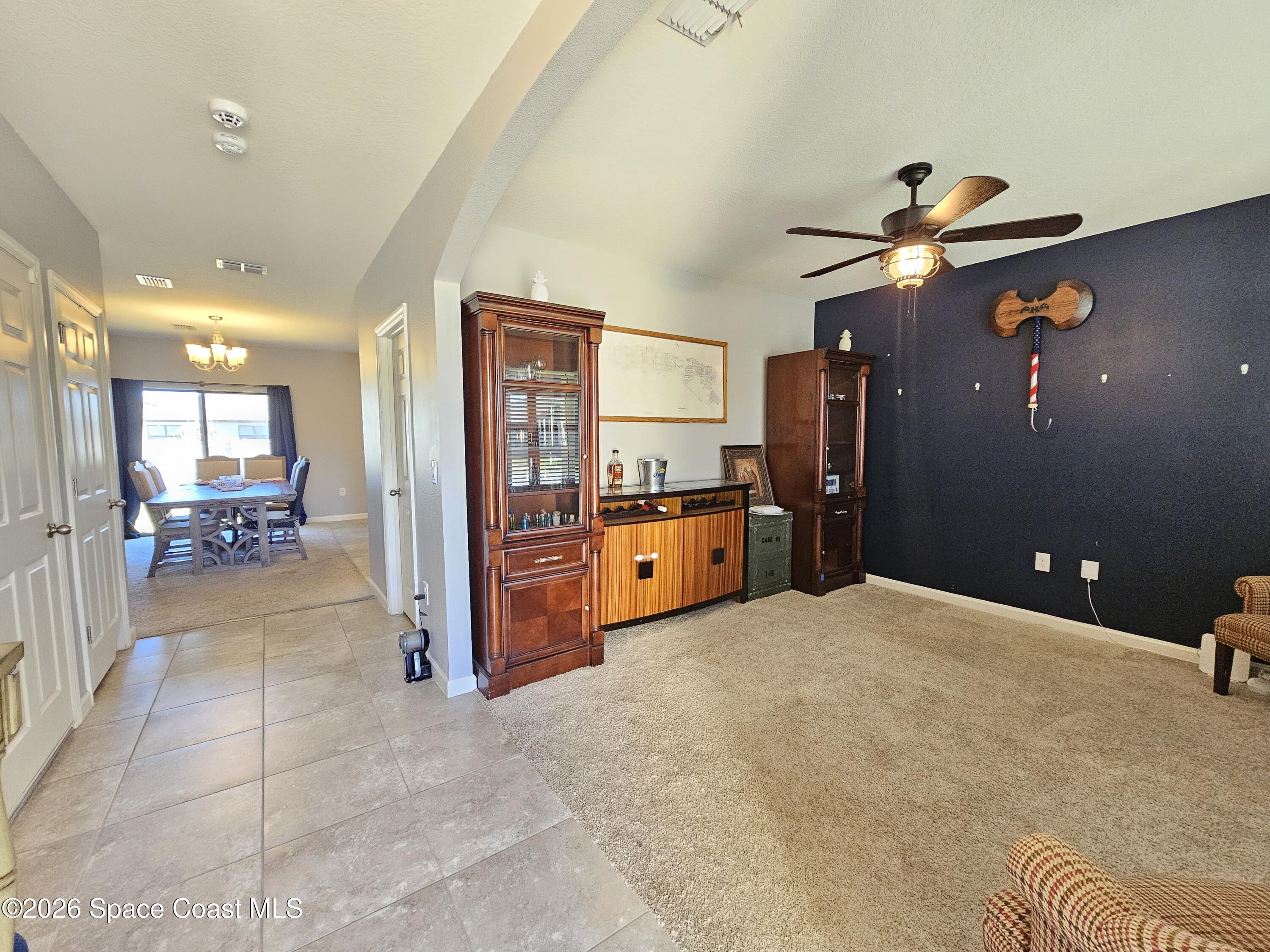 456 Snook Place Cocoa, FL 32927 - Photo 2 of 15 a view of an empty room with a kitchen