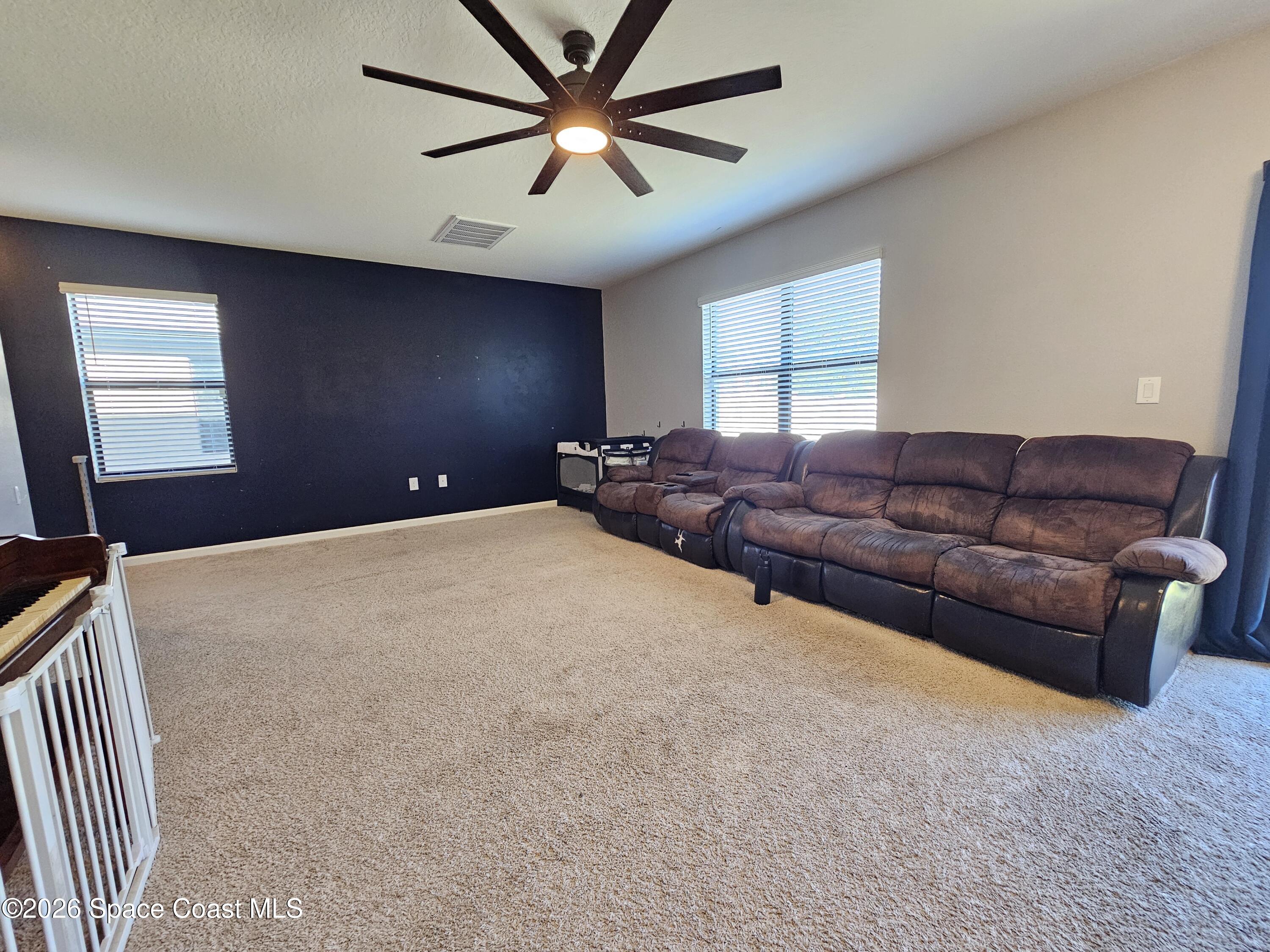456 Snook Place Cocoa, FL 32927 - Photo 7 of 15 a bed room with furniture and a window