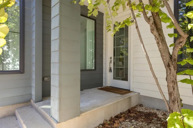 a balcony view with a rug