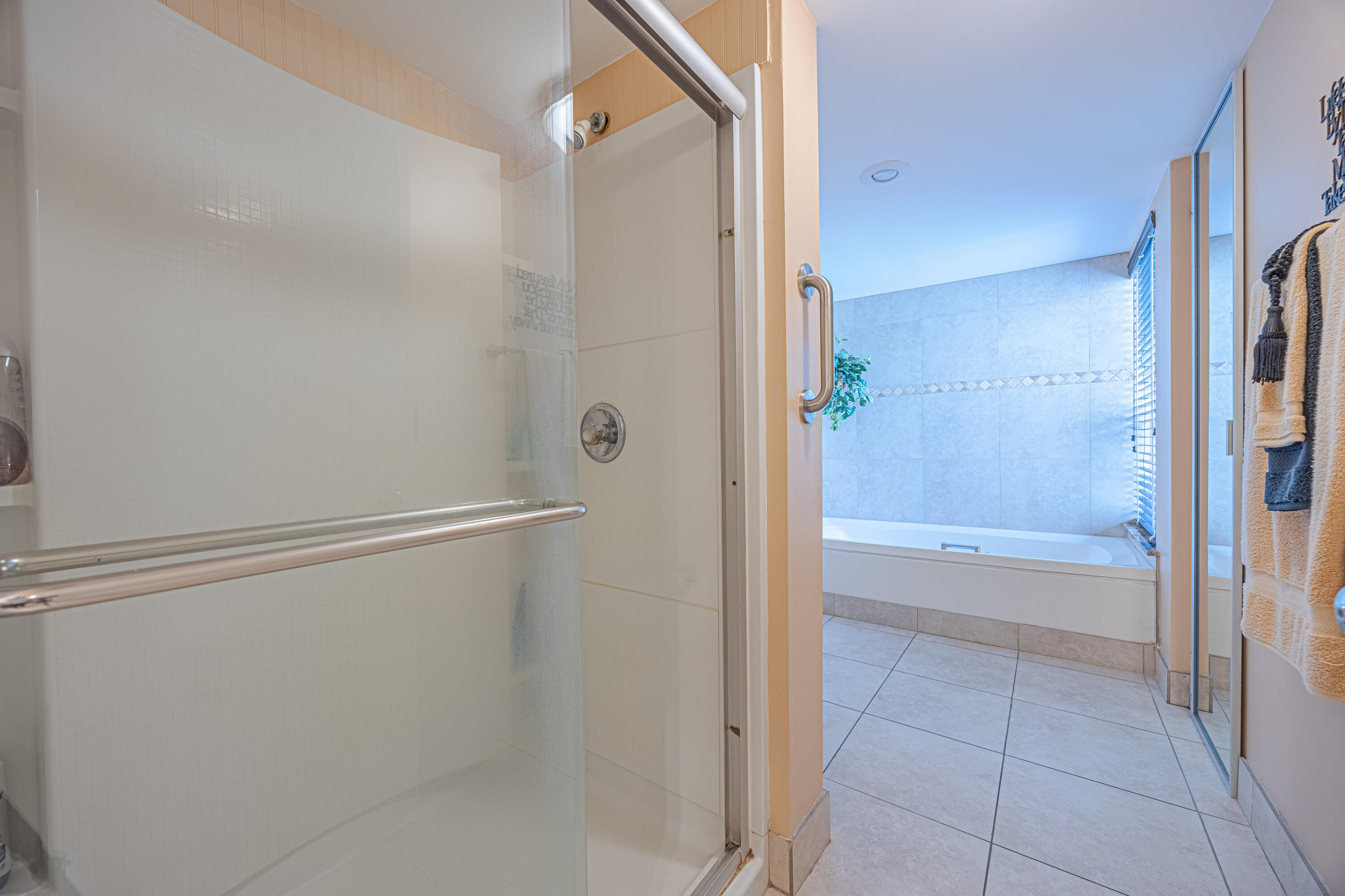 5750 Camino Del Sol, Unit 202 Boca Raton, FL 33433 - Photo 12 of 24 a bathroom with a bathtub and a shower