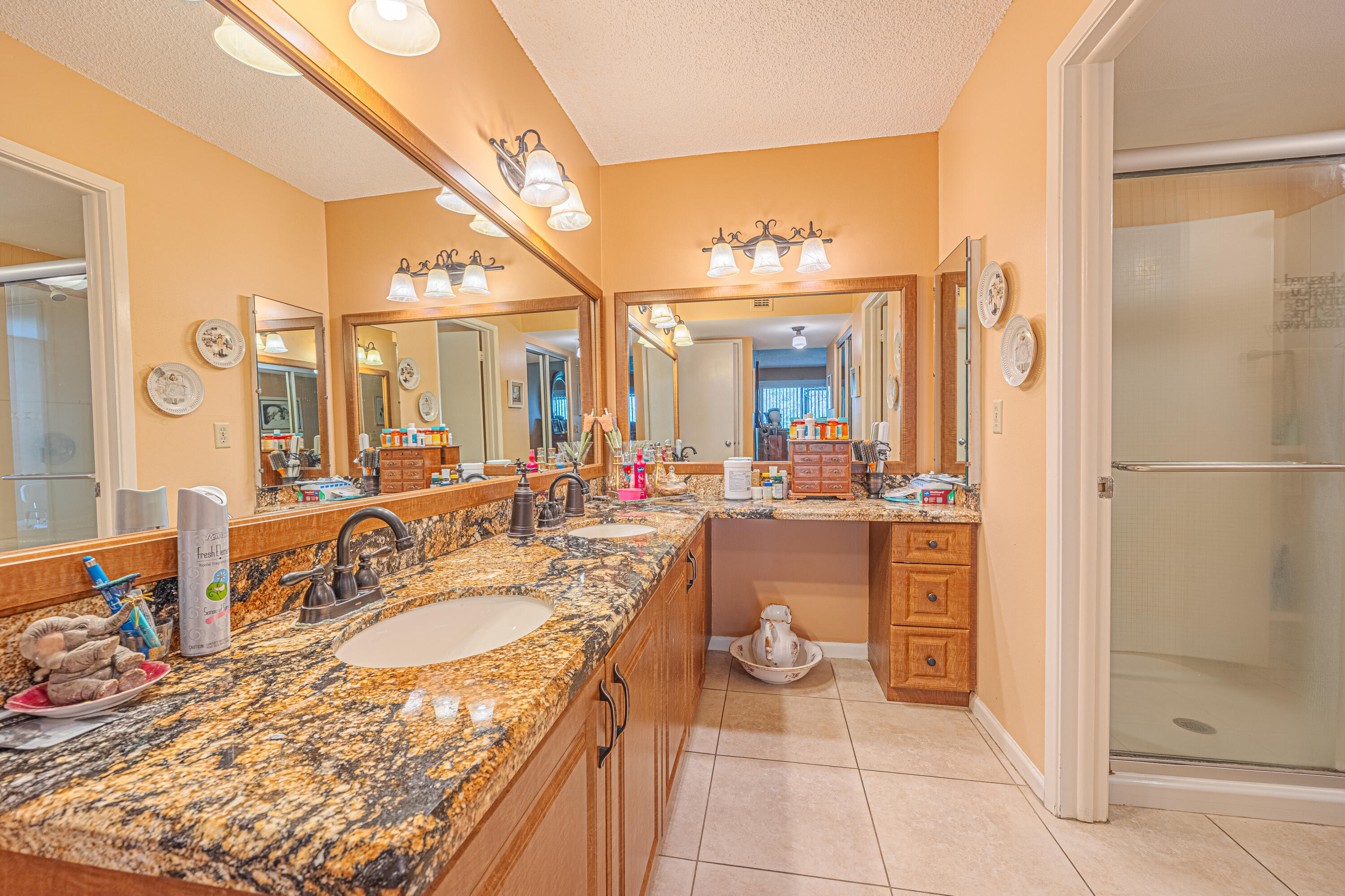 5750 Camino Del Sol, Unit 202 Boca Raton, FL 33433 - Photo 13 of 24 a bathroom with a granite countertop sink mirror and bathtub