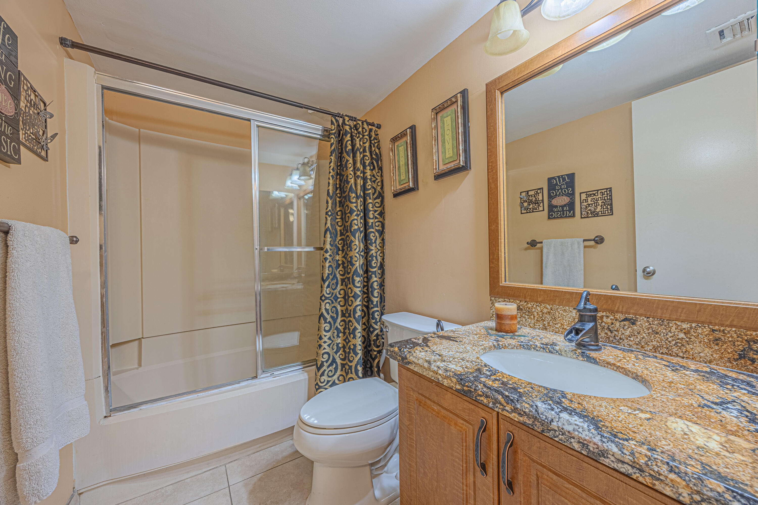 5750 Camino Del Sol, Unit 202 Boca Raton, FL 33433 - Photo 15 of 24 a bathroom with a granite countertop sink toilet and shower