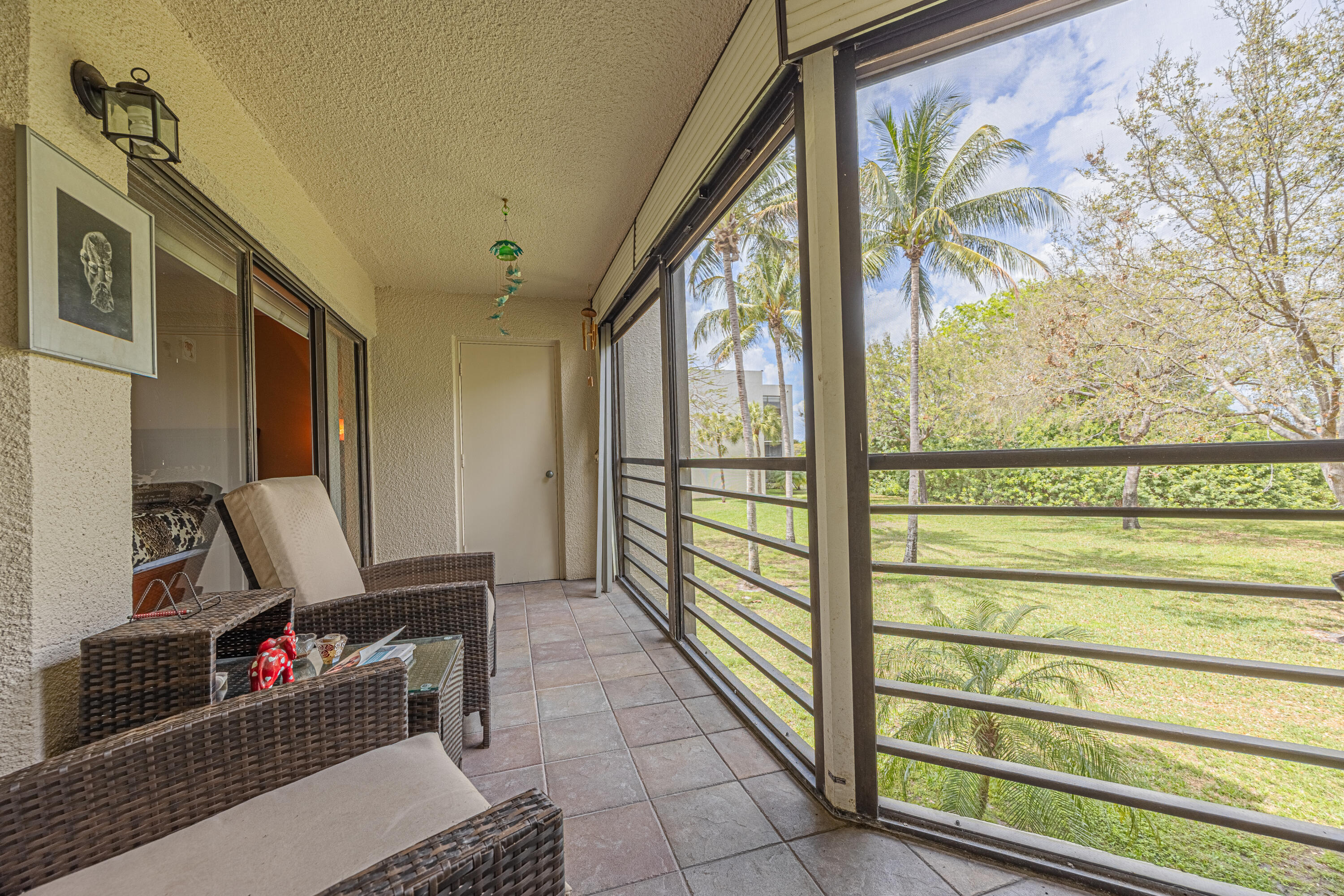 5750 Camino Del Sol, Unit 202 Boca Raton, FL 33433 - Photo 17 of 24 a view of a hallway with workspace