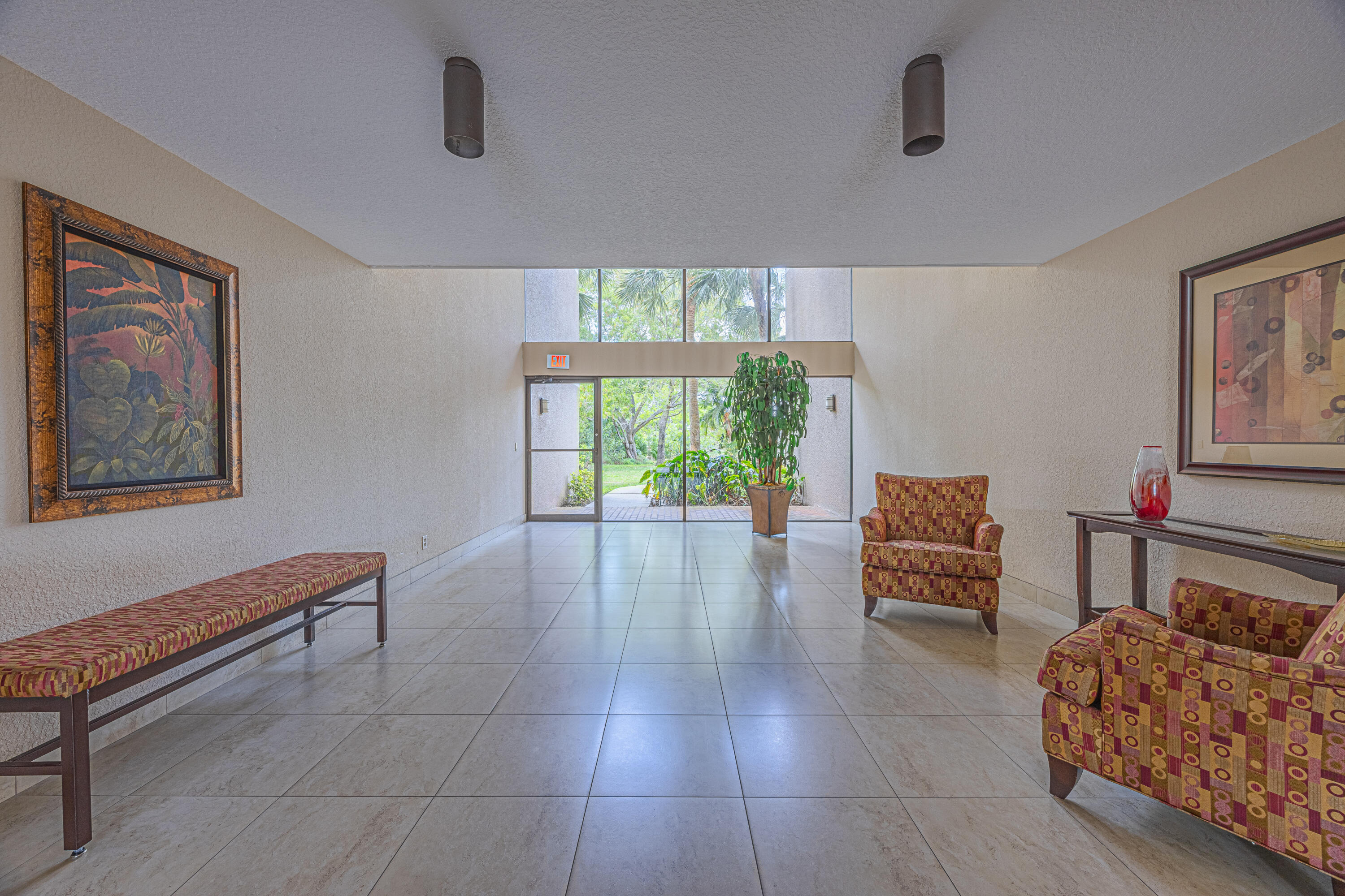5750 Camino Del Sol, Unit 202 Boca Raton, FL 33433 - Photo 20 of 24 a living room with furniture and a window
