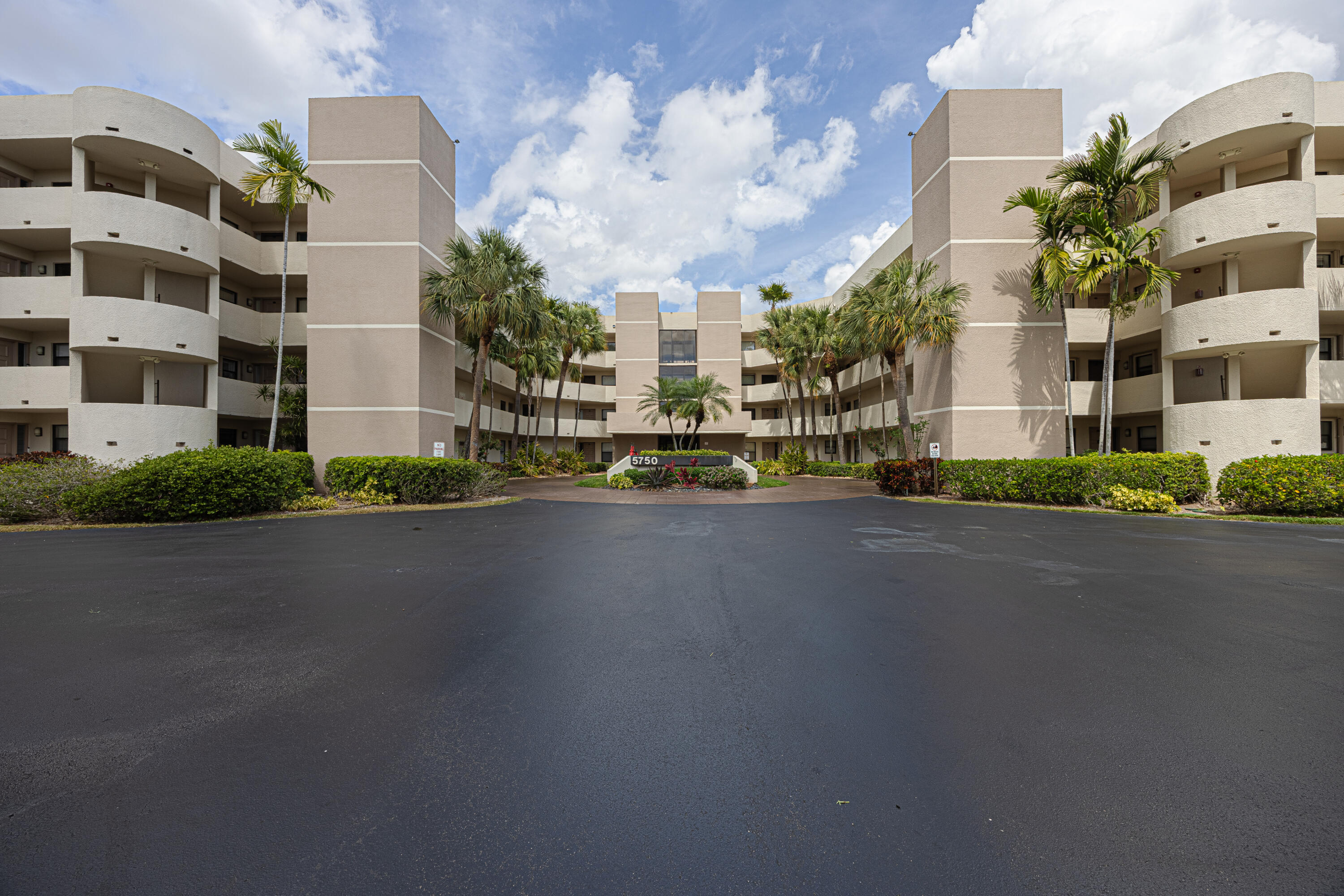 5750 Camino Del Sol, Unit 202 Boca Raton, FL 33433 - Photo 24 of 24 a view of a street with a building in the background