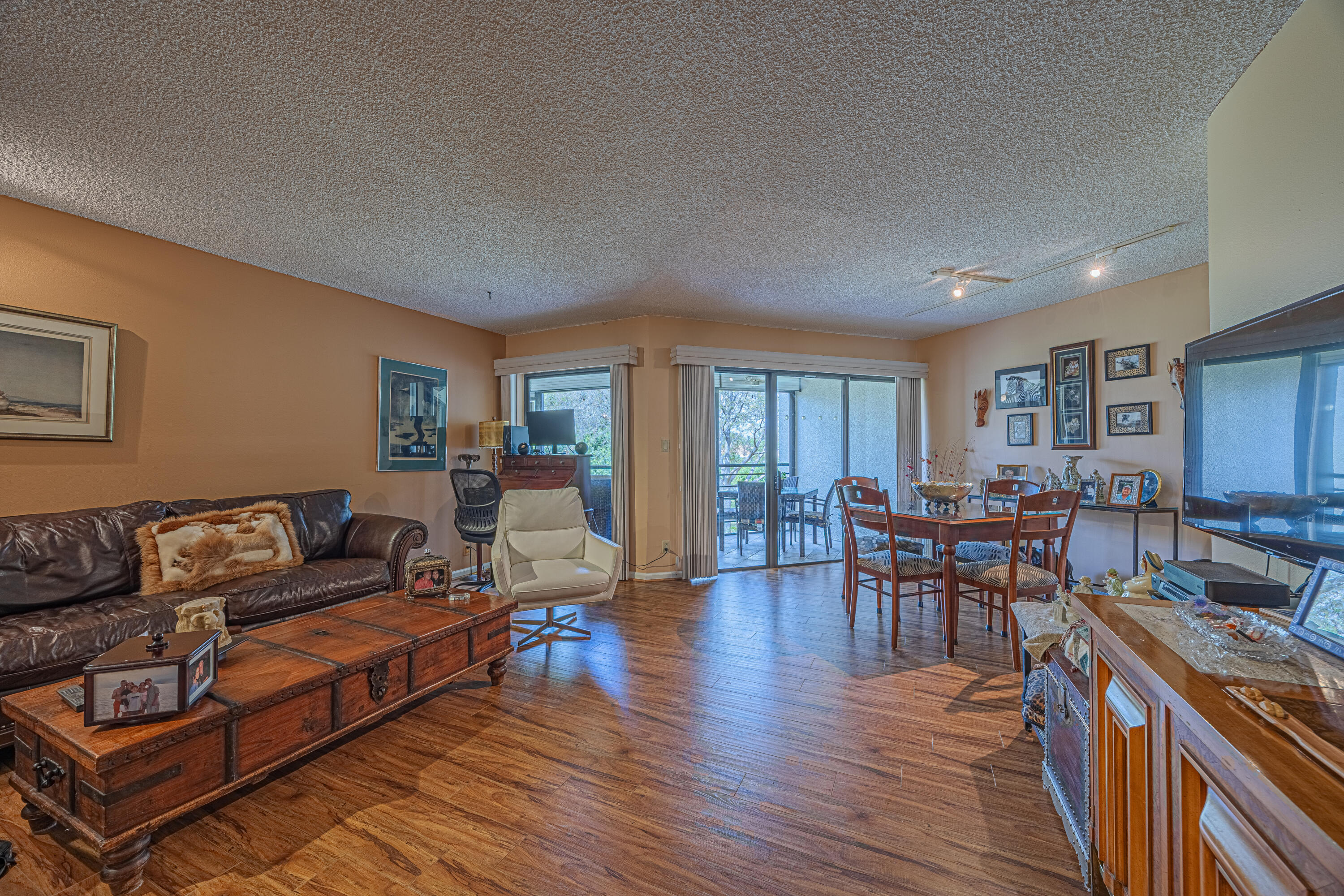 5750 Camino Del Sol, Unit 202 Boca Raton, FL 33433 - Photo 4 of 24 a living room with furniture and a wooden floor