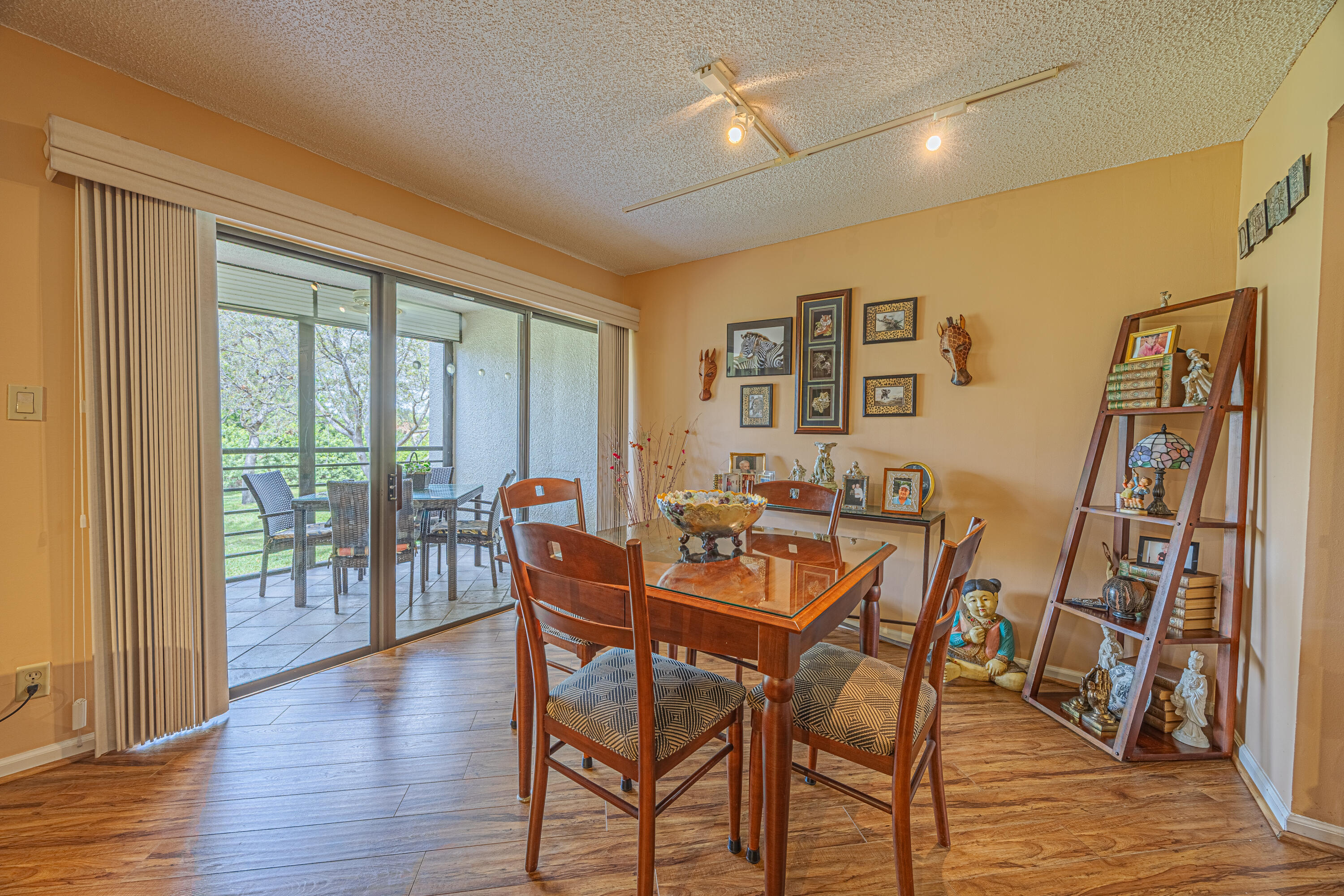 5750 Camino Del Sol, Unit 202 Boca Raton, FL 33433 - Photo 7 of 24 a dining room with furniture and wooden floor