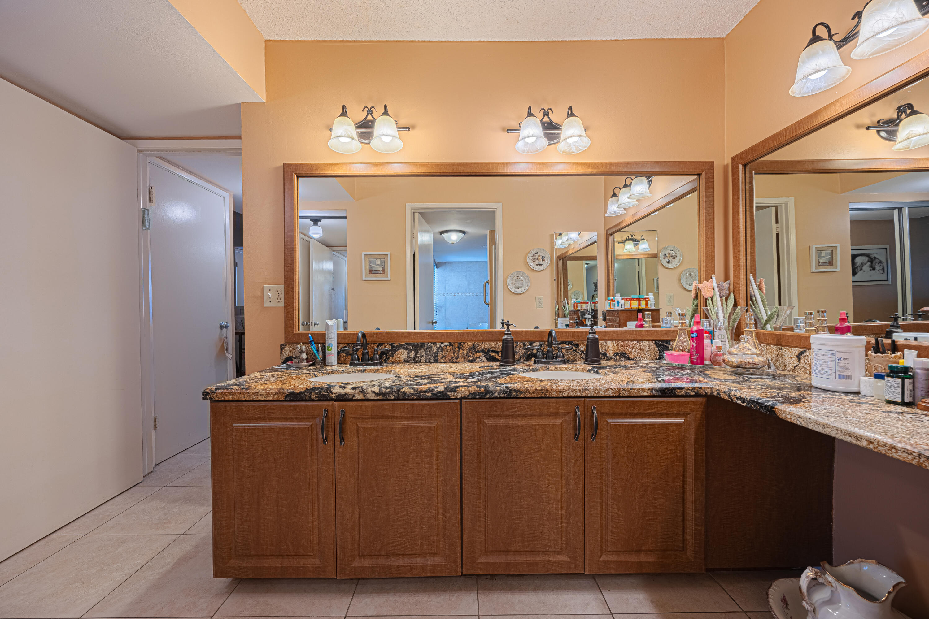 5750 Camino Del Sol, Unit 202 Boca Raton, FL 33433 - Photo 10 of 24 a kitchen with a sink and cabinets