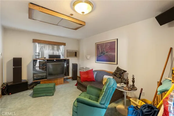 a view of a house with backyard porch and sitting area