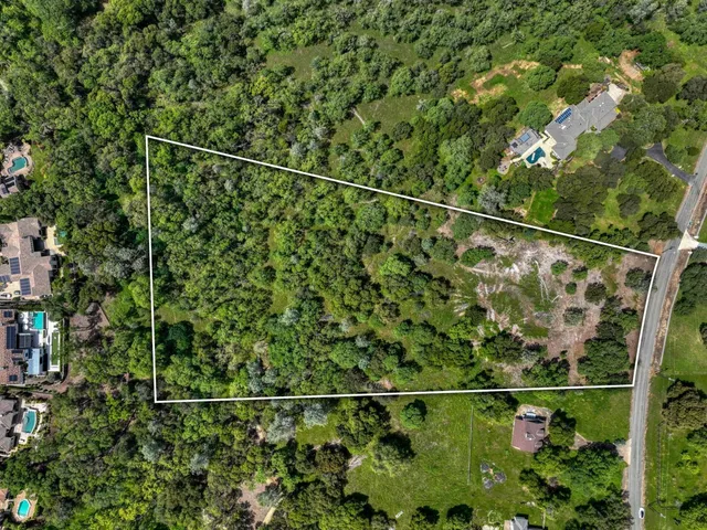 a large spacious bathroom with a double vanity sink a mirror and a bathtub