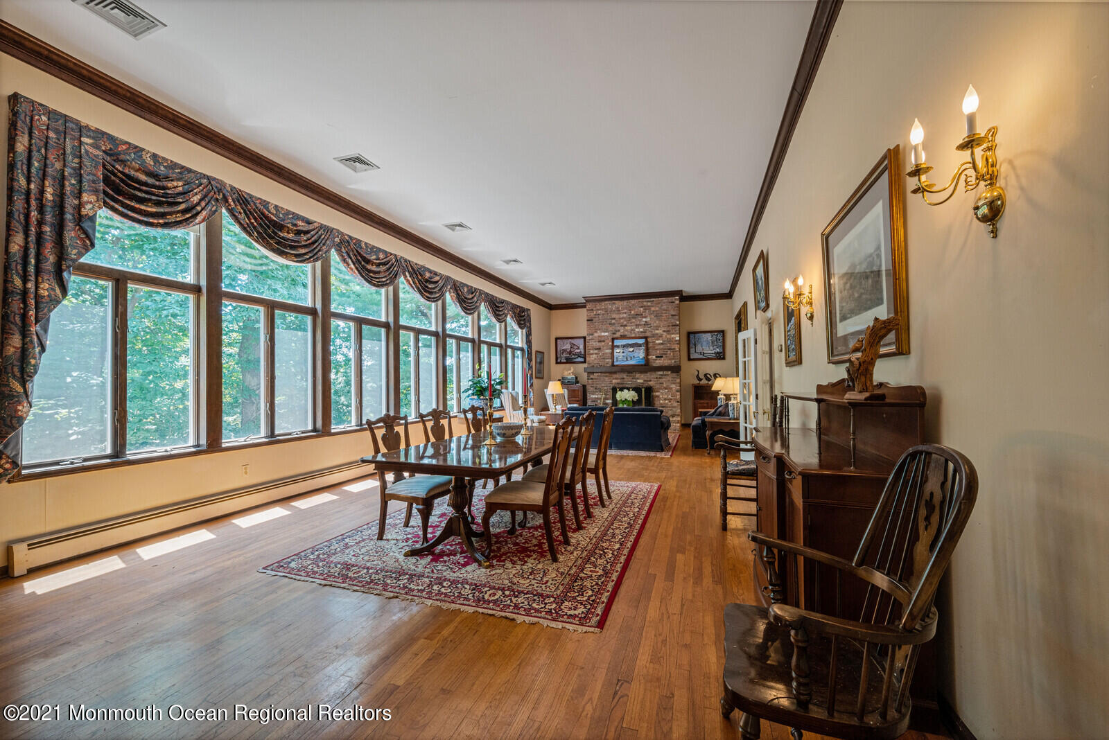 44 Wygant Road Cream Ridge, NJ 08514 - Photo 14 of 39 a dining room with furniture a floor to ceiling window and wooden floor
