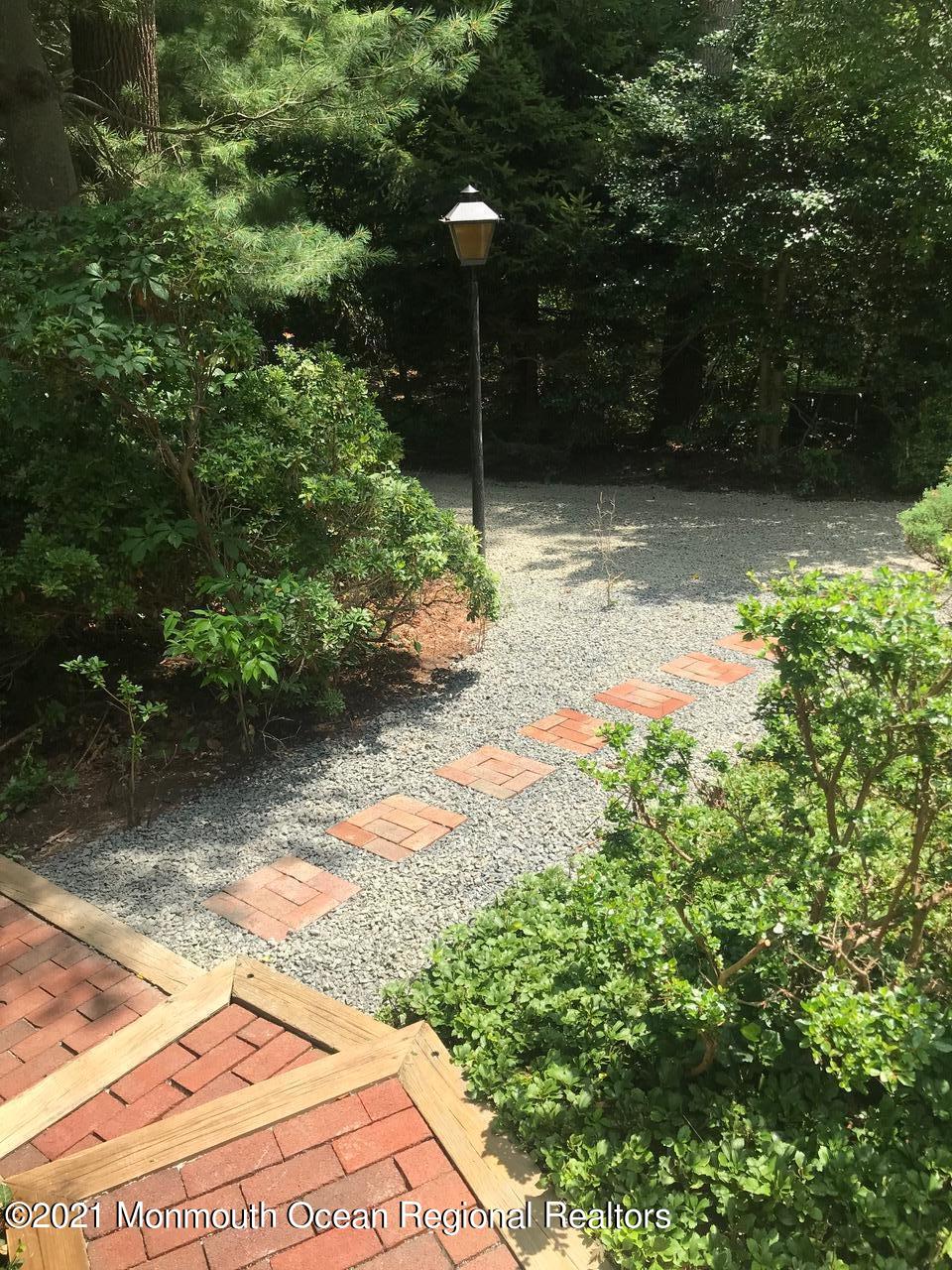 44 Wygant Road Cream Ridge, NJ 08514 - Photo 38 of 39 a backyard of a house with a yard and outdoor seating
