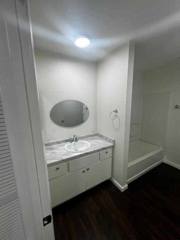 1405 East Cypress Avenue Reedley, CA 93654 - Photo 22 of 29 a bathroom with a double vanity sink and mirror
