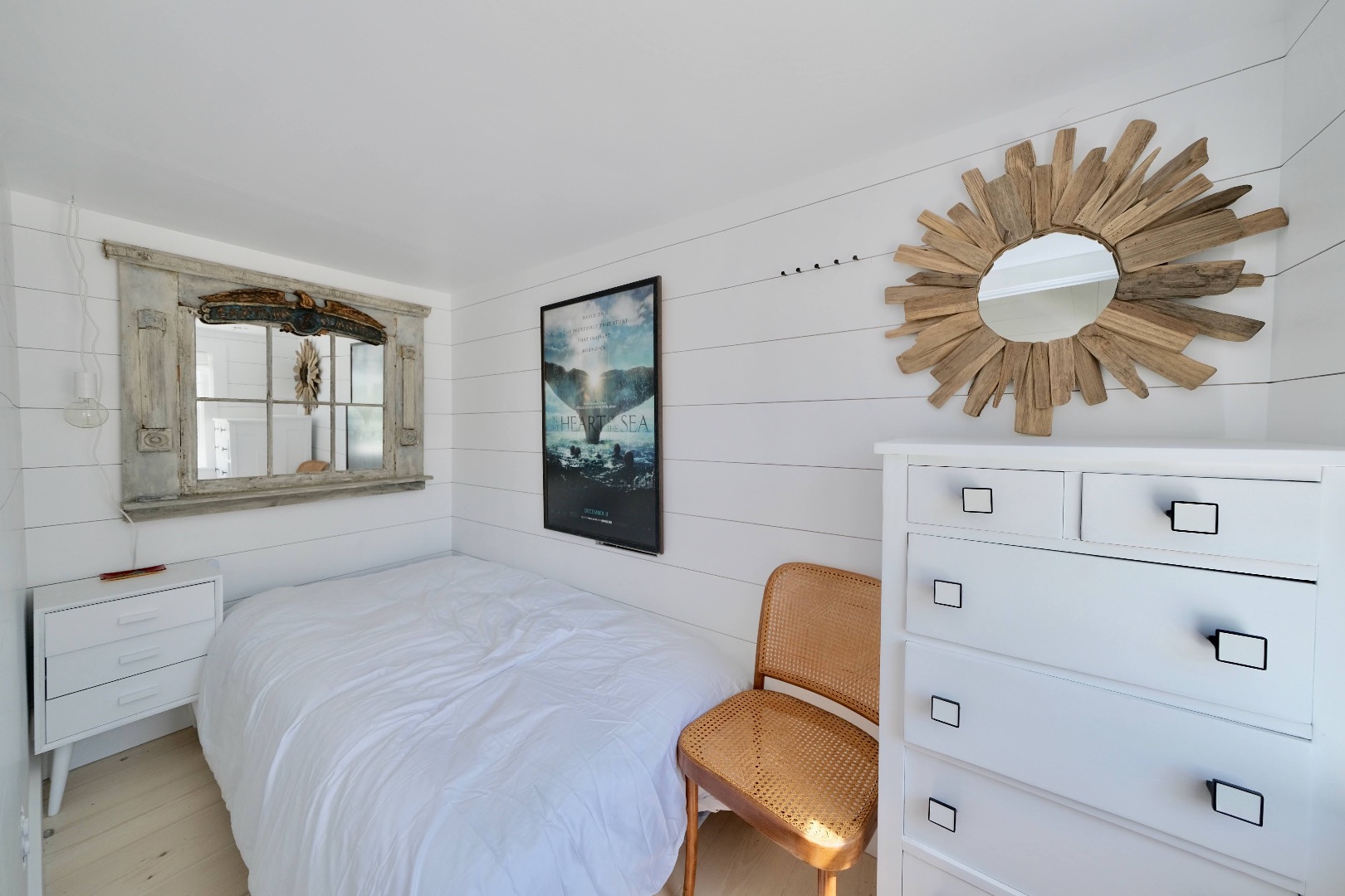 4 Cabot Lane Nantucket, MA 02554 - Photo 13 of 16 a bedroom with a bed and chandelier